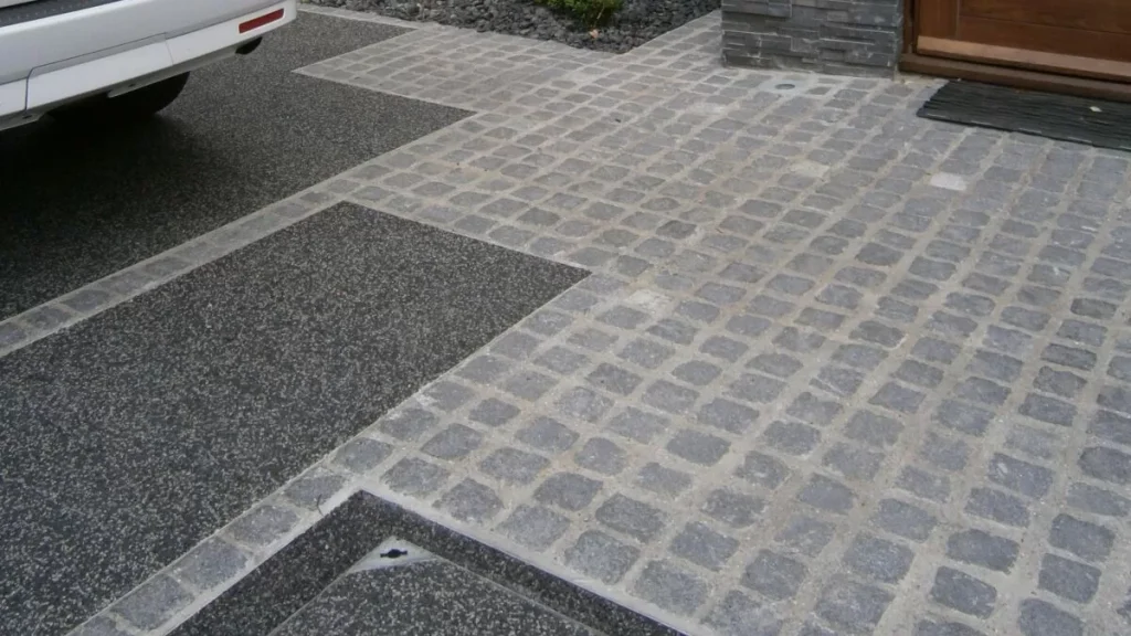 Grey square block paving installed by Greenstone landscapes in Essex
