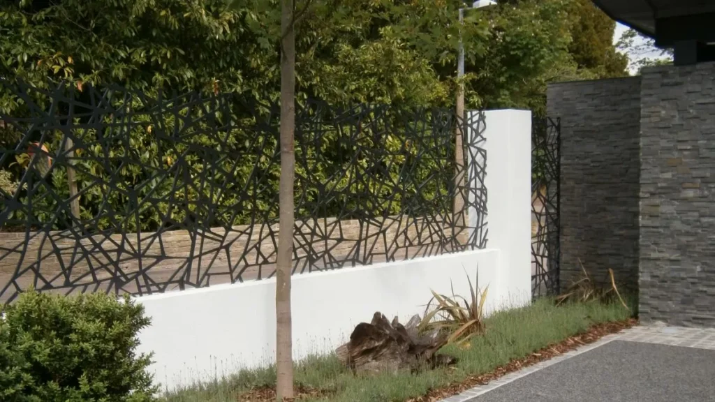 Bespoke fencing above wall