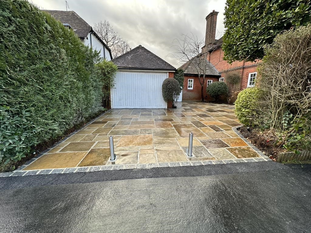 Completed Yorkstone driveway transformation with security bollards in Sheffield, Essex