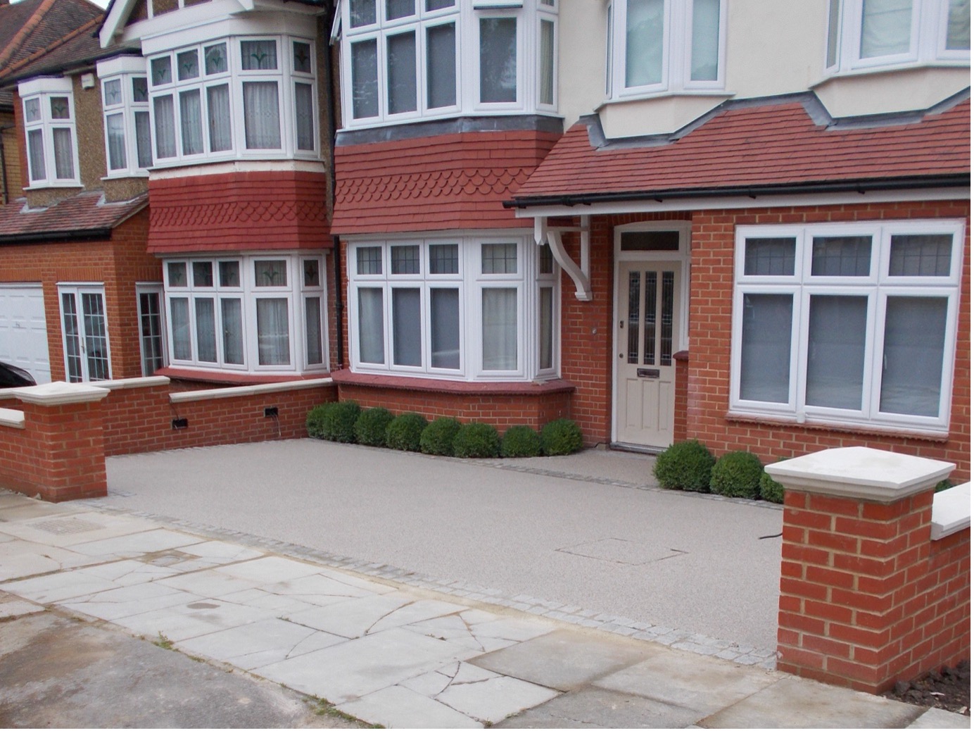 resin driveway and new brick wall after